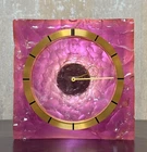 Jaeger Lecoultre 8 Day Movement Brass Pinck Relief-patterned Plexiglass Clock Used. Price: $2200.00.