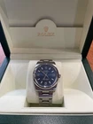Rolex Air King 34MM Blue Dial + Excellent Condition Box, Tags And Manuals Pre-owned. Price: $6500.00.